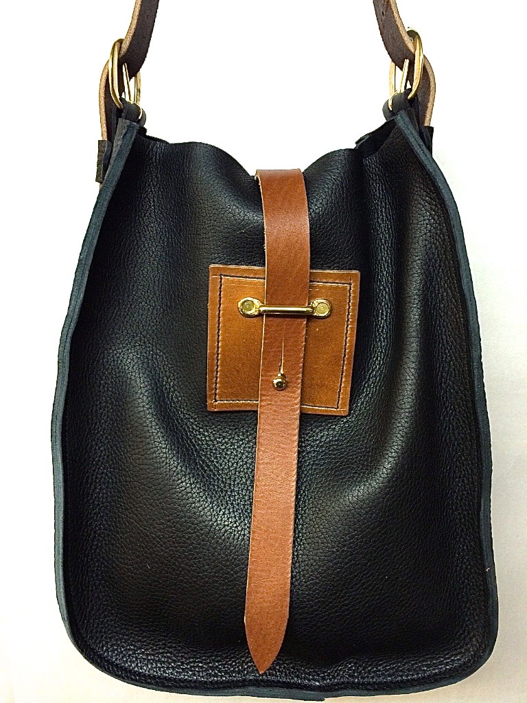 Big sling with strap closure $225 in black with golden latigo strap